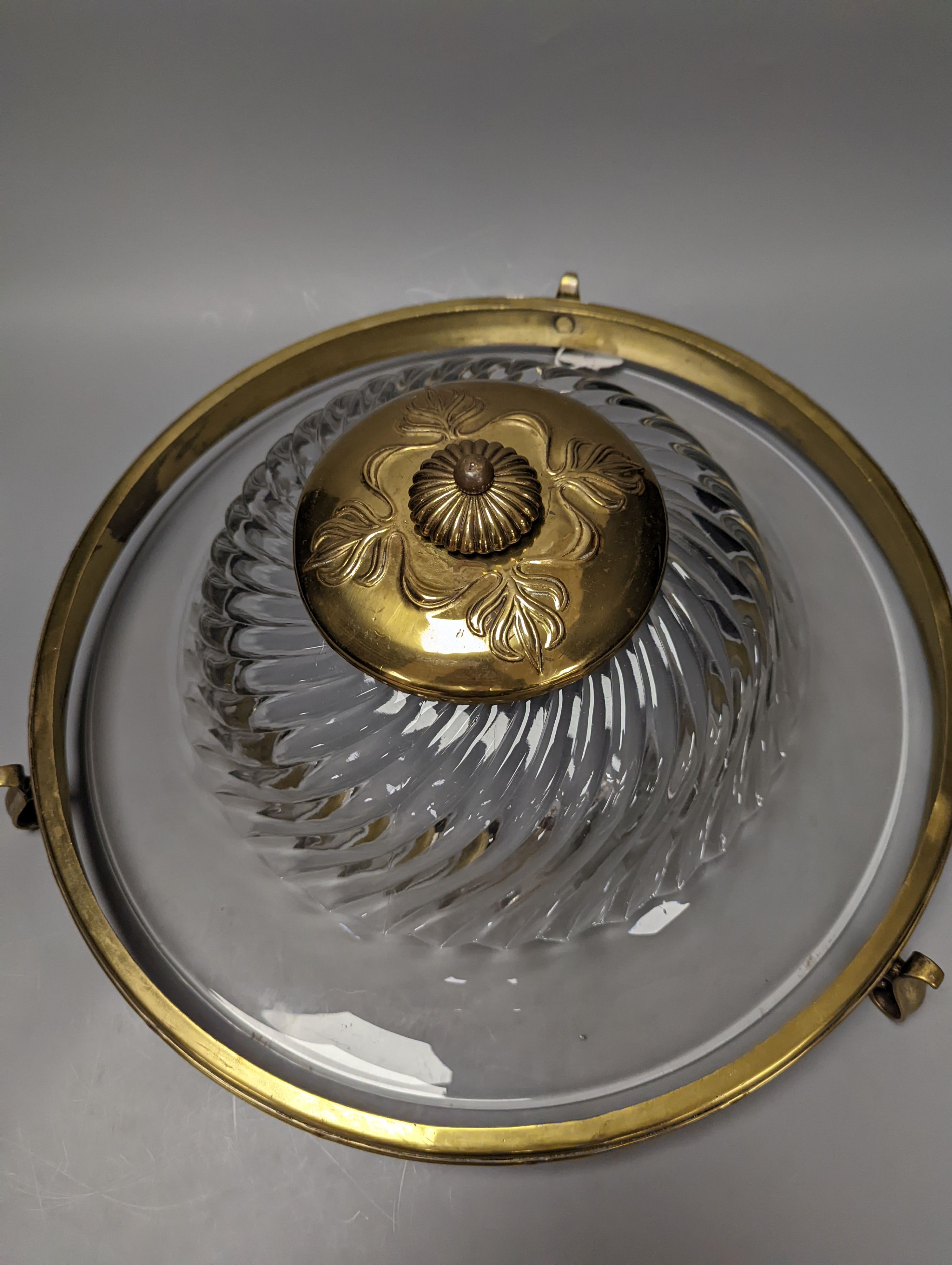 A circular brass and glass plathonier, first half 20th century , 42 cms diameter.